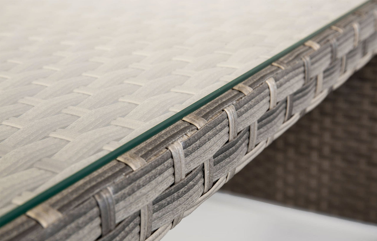 Gray woven resin table edge with clear glass top from palma grey rattan garden lounge set and corner sofa bundle