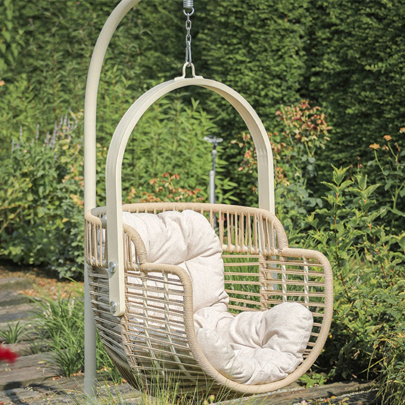 Beige woven paloma rattan garden hanging egg chair with cream cushioned seat for indoor outdoor use