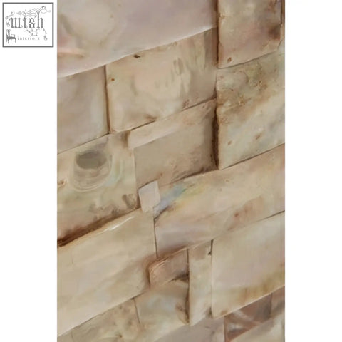 Beige and cream natural shell wall mirror with textured stone veneer in the palu natural shell style