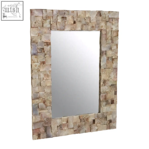Rectangular natural shell wall mirror with a frame of irregular light beige and cream stone tiles perfect for decor