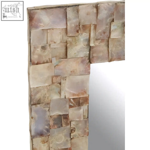 Palu natural shell wall mirror with rectangular shape and earth-toned stone tile frame in beige and brown shades