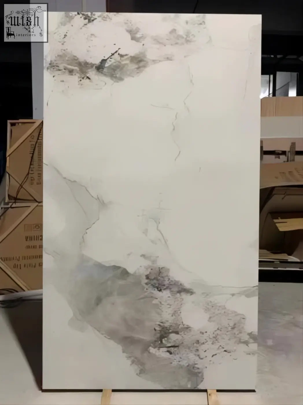 A large rectangular white marble sintered stone slab with gray veining and a gloss finish called pandora gloss finish