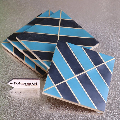 Panna luxe resin coaster set of 4 with hand-shaped blue and navy geometric mosaic tiles and white grout lines