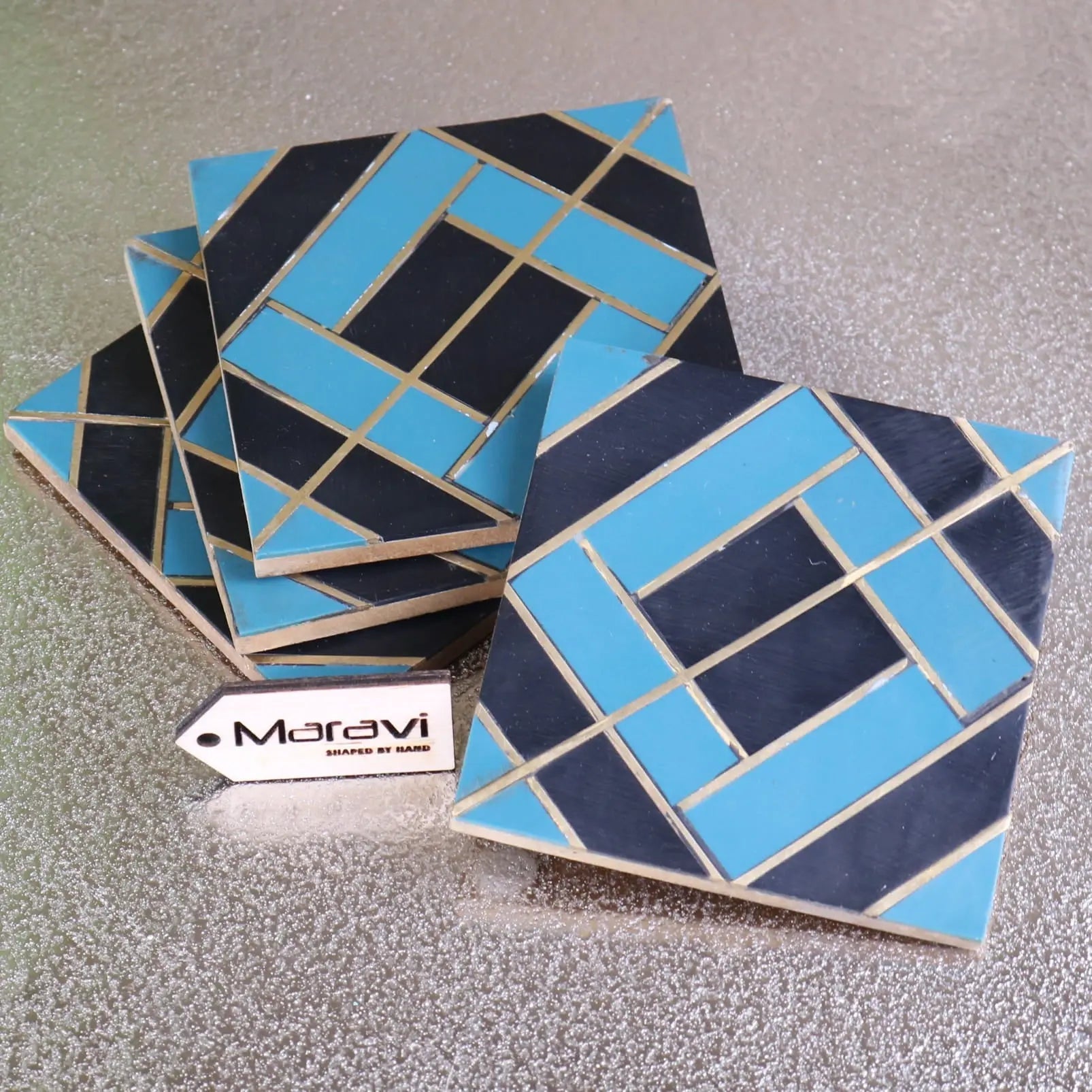 Handcrafted panna luxe resin coaster set of 4 with bold turquoise and navy blue geometric pattern and gold grout lines