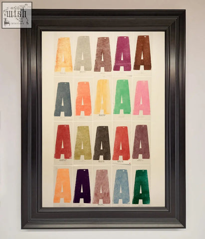 Framed poster featuring a grid of colorful textured capital a letters in orange gray purple and more with frame options