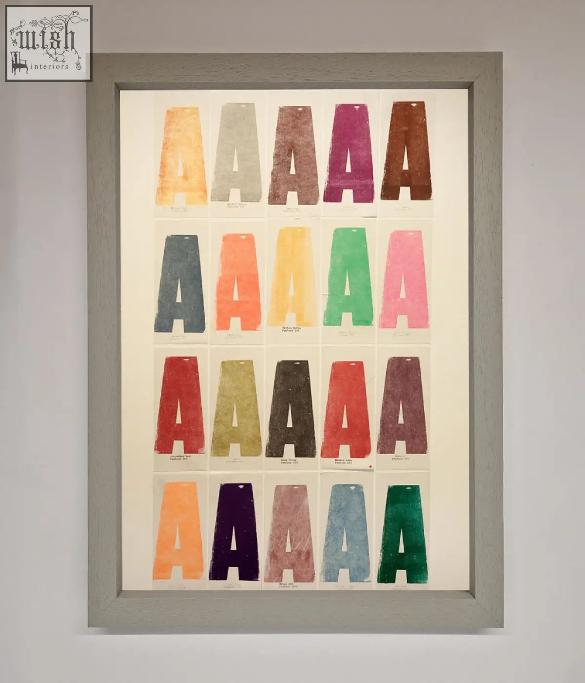 A colorful framed poster showing a grid of textured capital a letters in orange purple green and red with frame options