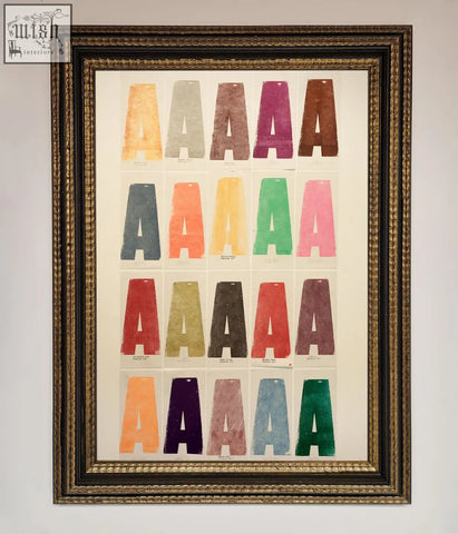 A framed poster showing a colorful textured grid of capital a letters with multiple frame options available