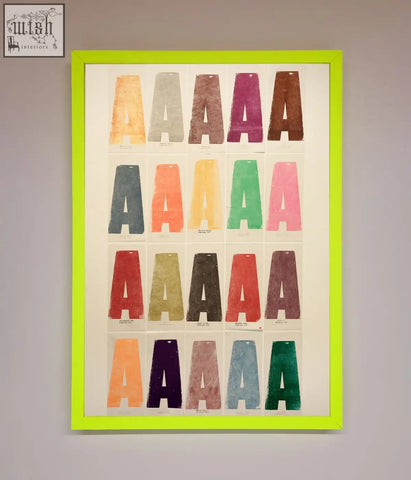 A vibrant lime green framed poster featuring a grid of colorful textured letters with various frame options