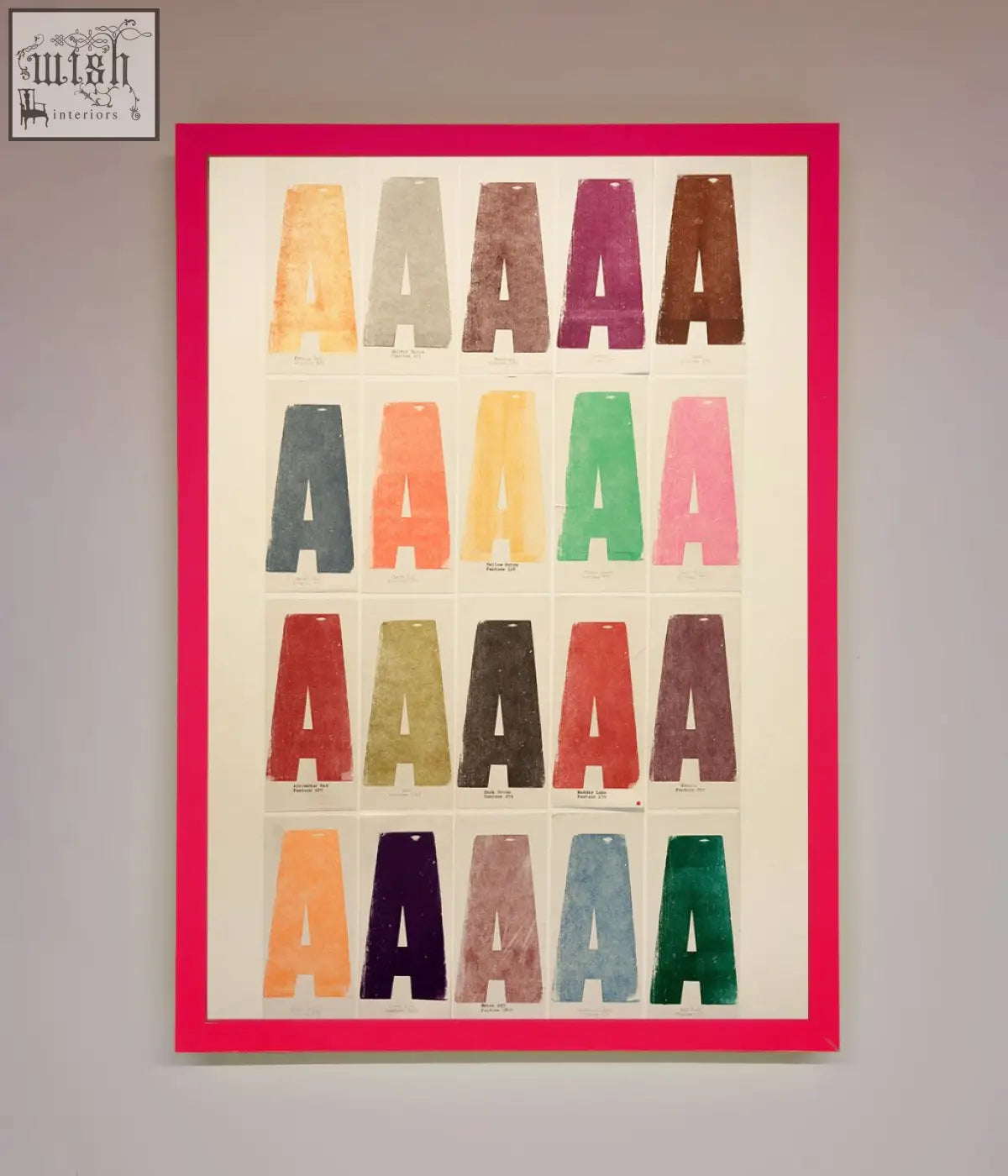 A vibrant pink-framed poster with colorful textured capital a letters in various hues, perfect for frame options and decor