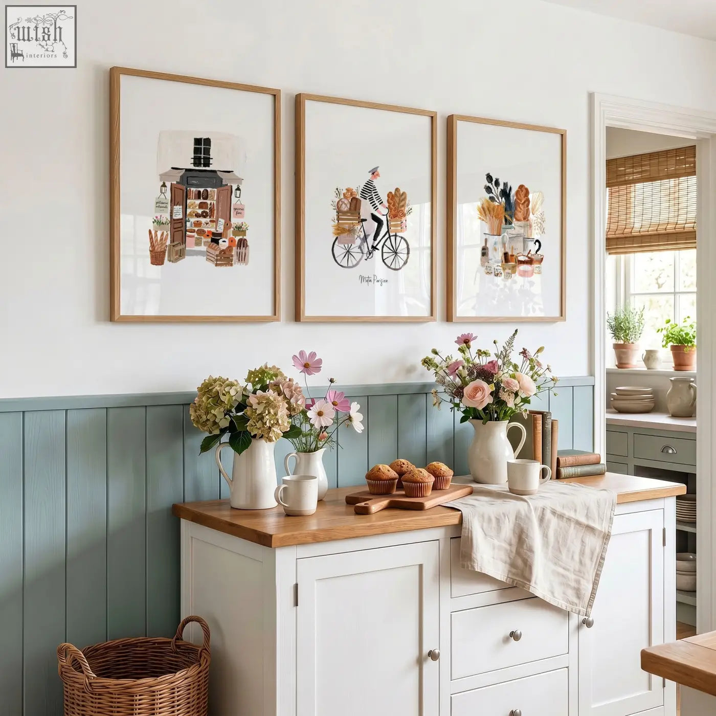 Three rustic wooden framed matin parisien wall art prints in brown tones hang above a kitchen counter