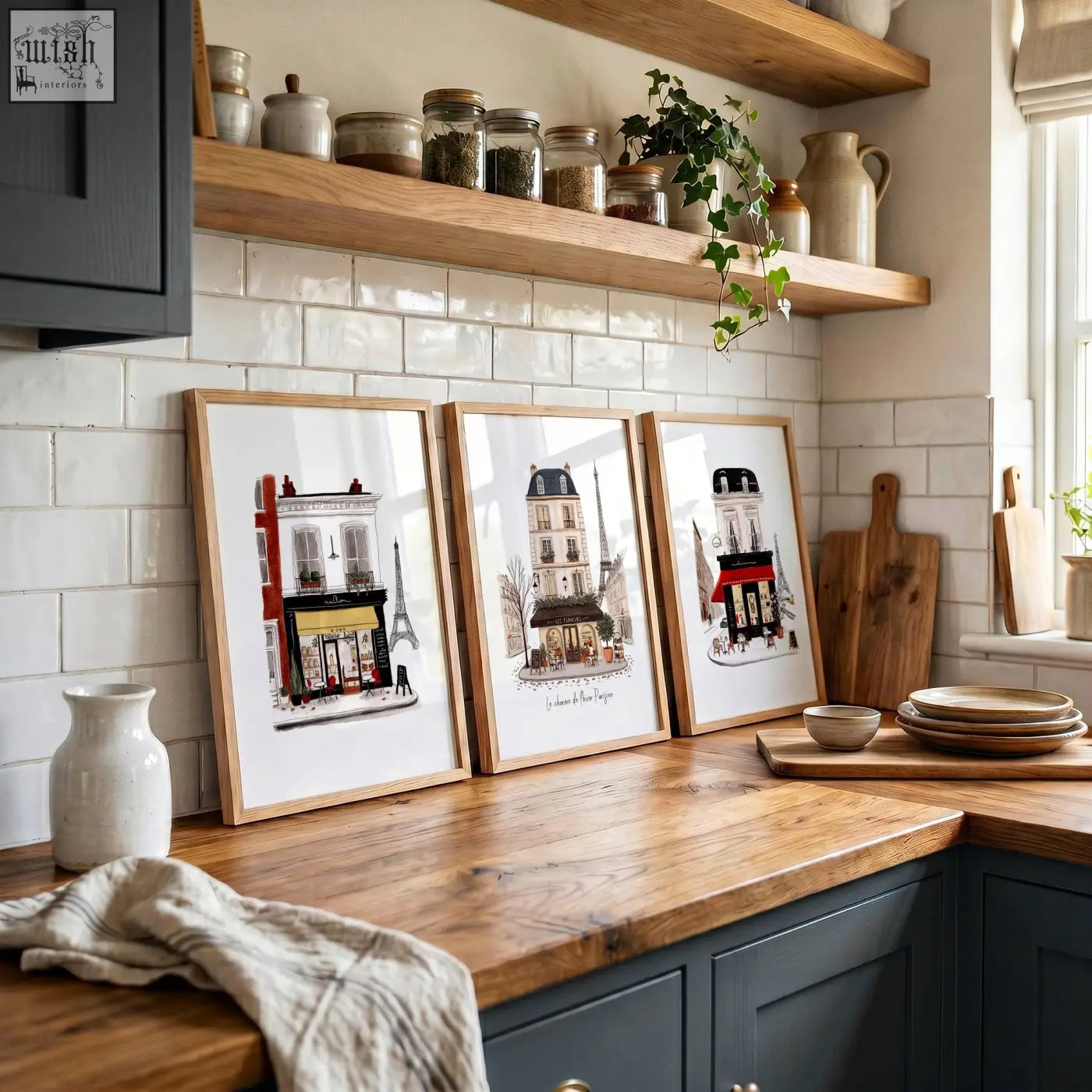 Three light wood framed parisian-themed kitchen art prints featuring iconic french buildings including the eiffel tower