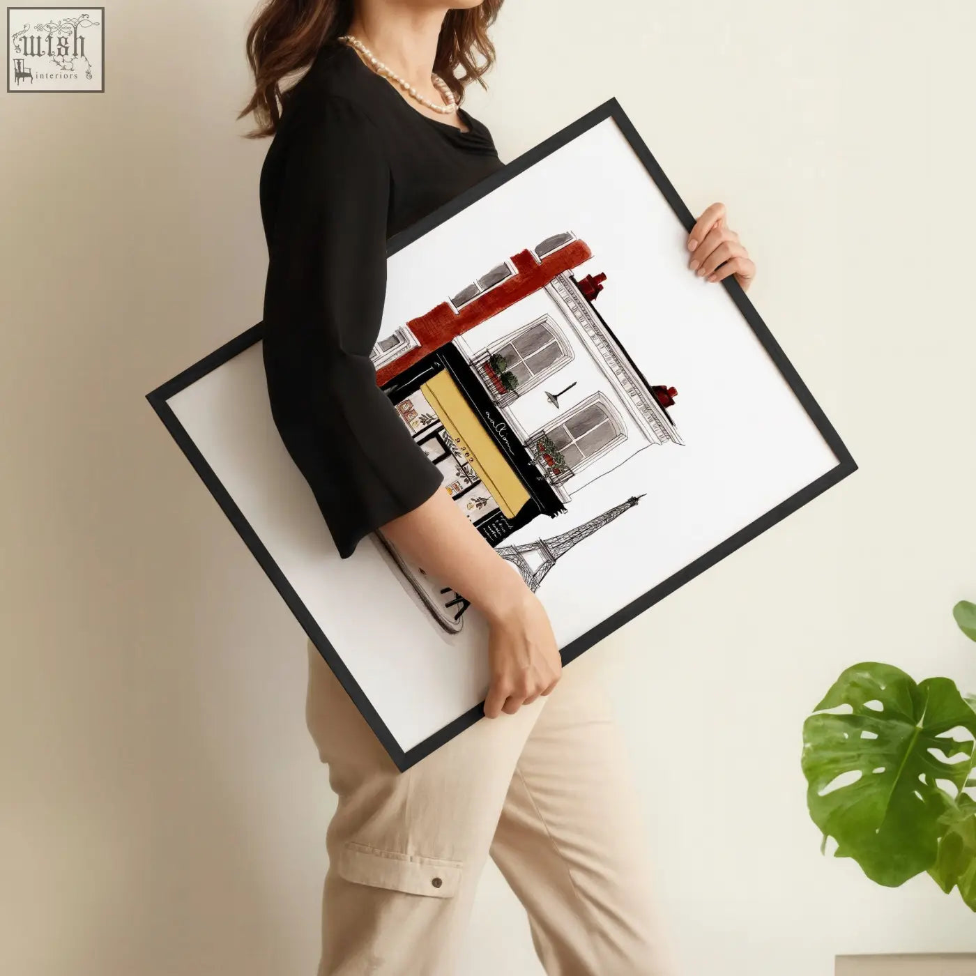 Black-framed kitchen art prints of stylized parisian architecture with red and gold accents perfect for kitchen art