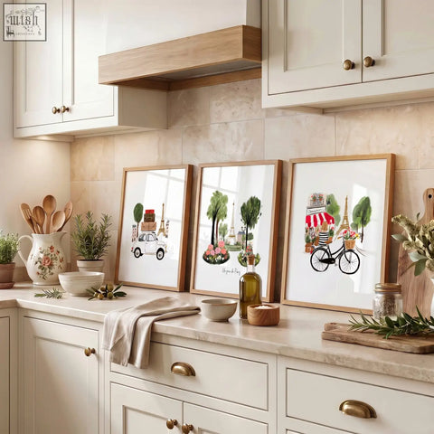 Three paris eiffel tower art prints with light wood frames on a kitchen countertop perfect for prints kitchen decor
