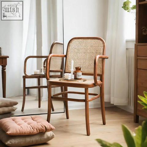 A warm-toned paris g04 rattan dining chair in walnut with woven cane back and seat and curved wooden arms and legs