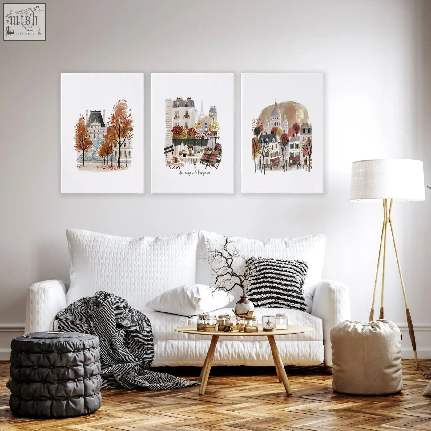 Three framed paris travel living room wall art prints featuring autumn louvre eiffel tower and montmartre scenes above a white sofa