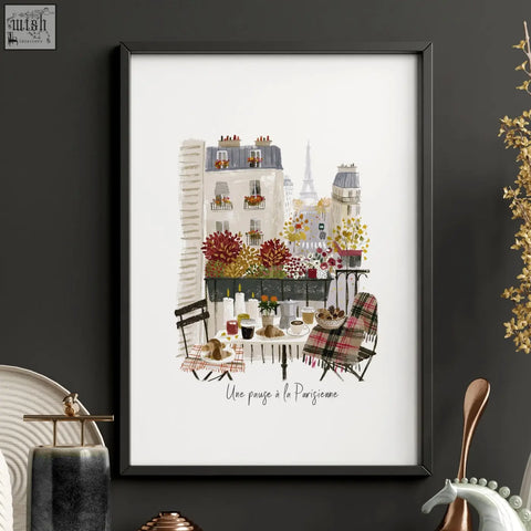 A framed paris travel wall art piece showing a colorful balcony scene with flowers, café furniture, and the eiffel tower