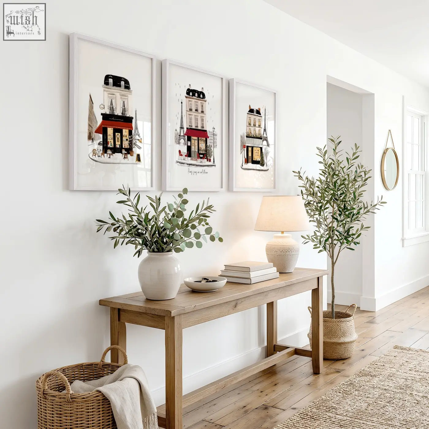 A rustic wooden console table with natural finish holding white ceramic vase and paris travel wall art pieces set of 3
