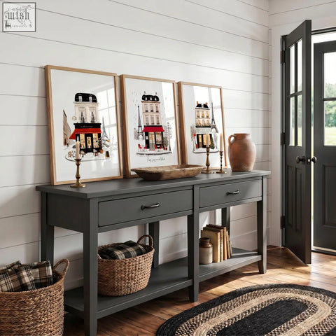 Gray wooden console table with two drawers and black metal handles displaying paris travel wall art pieces set of 3