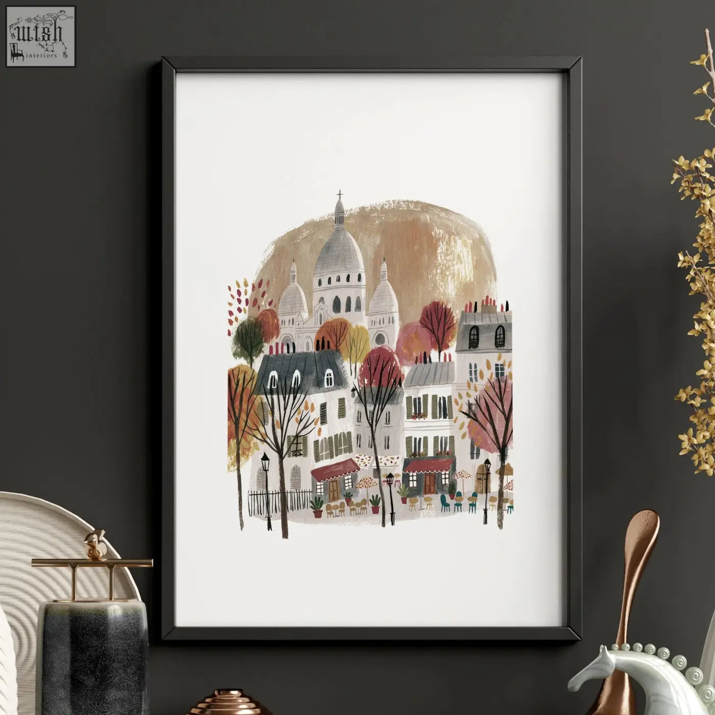 Black-framed wall art piece showing a stylized parisian street with autumn trees and sacré-cœur basilica in paris travel set