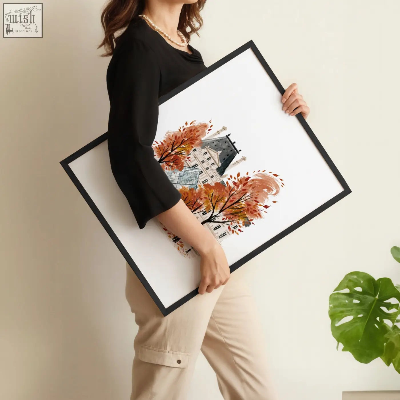 Black-framed wall art piece featuring a watercolor illustration of autumn trees and a paris building