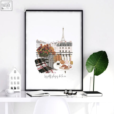 Black-framed paris wall art print showing autumnal flowers breakfast and eiffel tower on a parisian balcony