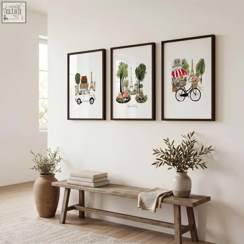 Three paris wall art prints with eiffel tower illustrations in black frames above a rustic wooden bench