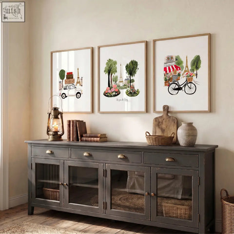 Dark gray wooden sideboard with glass paneled doors and brass handles below paris wall art eiffel tower travel prints set of 3