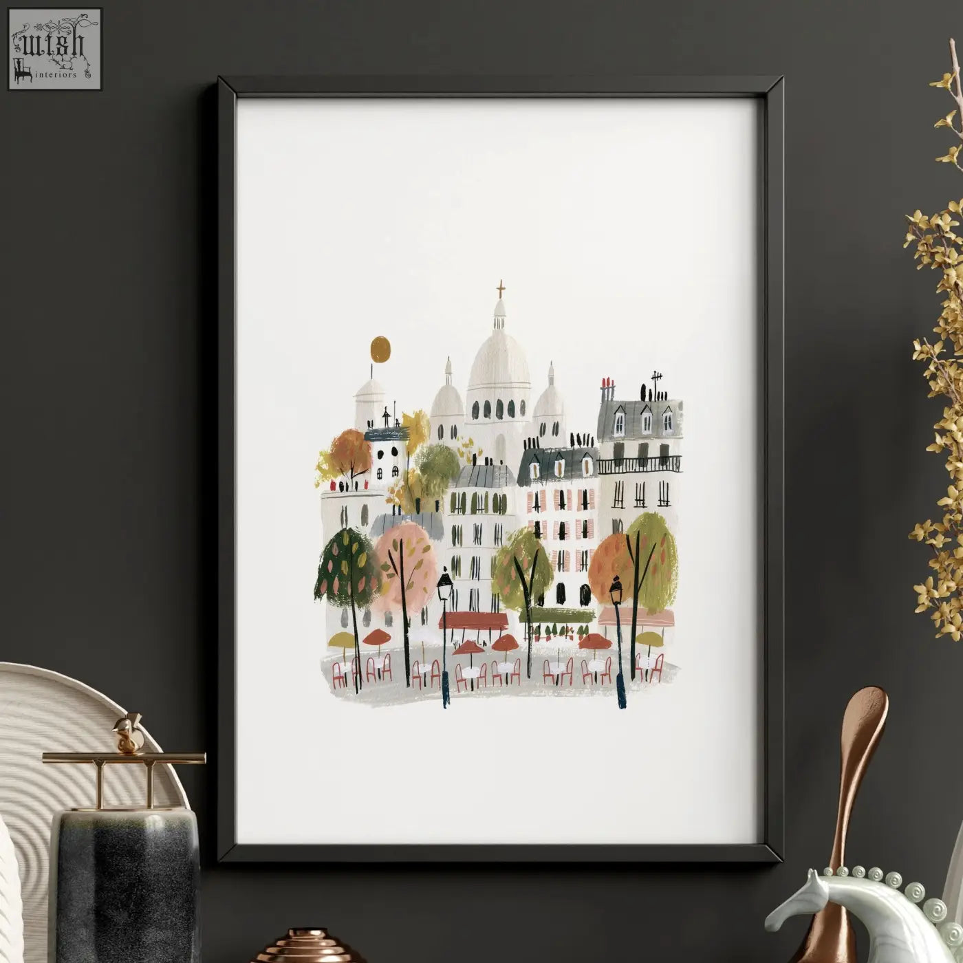A framed paris wall art illustration of a pastel autumn street with café tables for living room decor