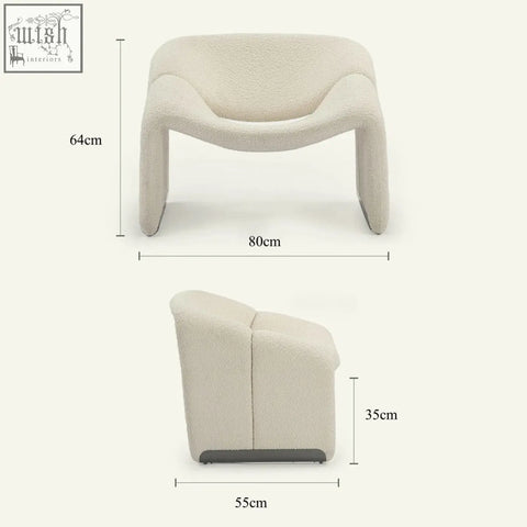 Cream-colored paris wawa boucle armchair with plush texture and sleek black base for modern living spaces