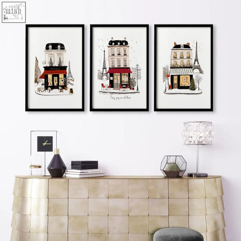 Three framed parisian-themed living room wall art with black frames and white backgrounds featuring café scenes