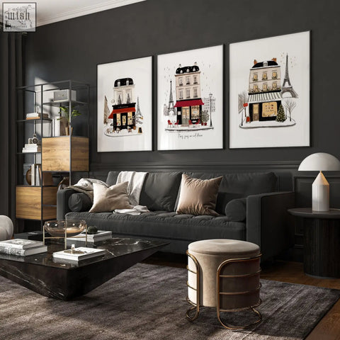 Black marble coffee table with glass bowl and books in a living room featuring paris winter street scene wall art canvas