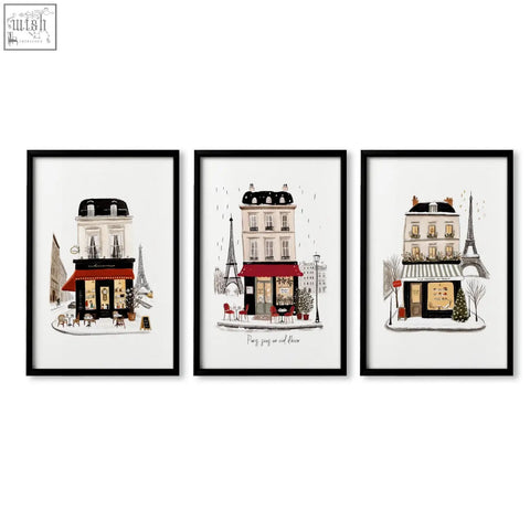 Set of three black-framed parisian café wall art prints for living room wall featuring winter street scenes