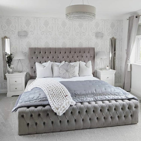 Gray tufted velvet platform park lane bed with matching headboard footboard white bedding and chunky knit throw