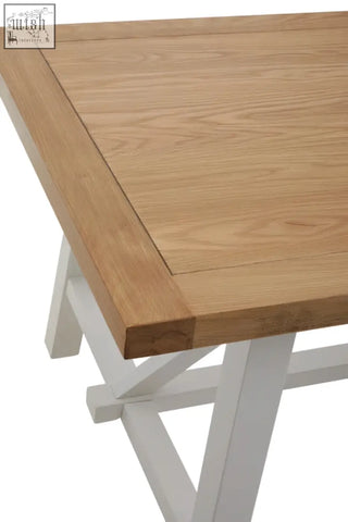 Parkside natural oak dining table with light oak top and white painted x-frame legs perfect for natural oak dining
