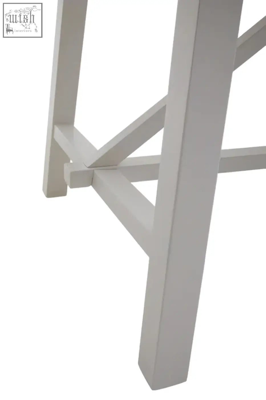 White painted wooden stool leg with simple design beside parkside natural oak dining table oak dining table detail