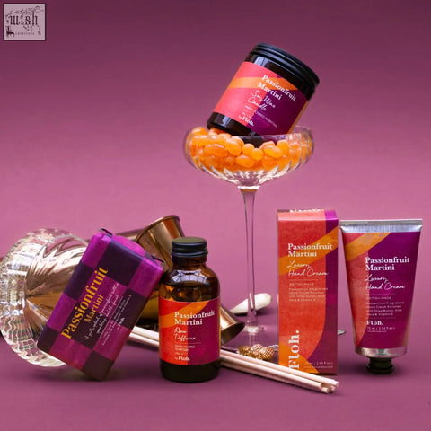 Passionfruit martini luxury hand cream in a sleek silver tube with vibrant purple and orange branding for apothecary candle fans