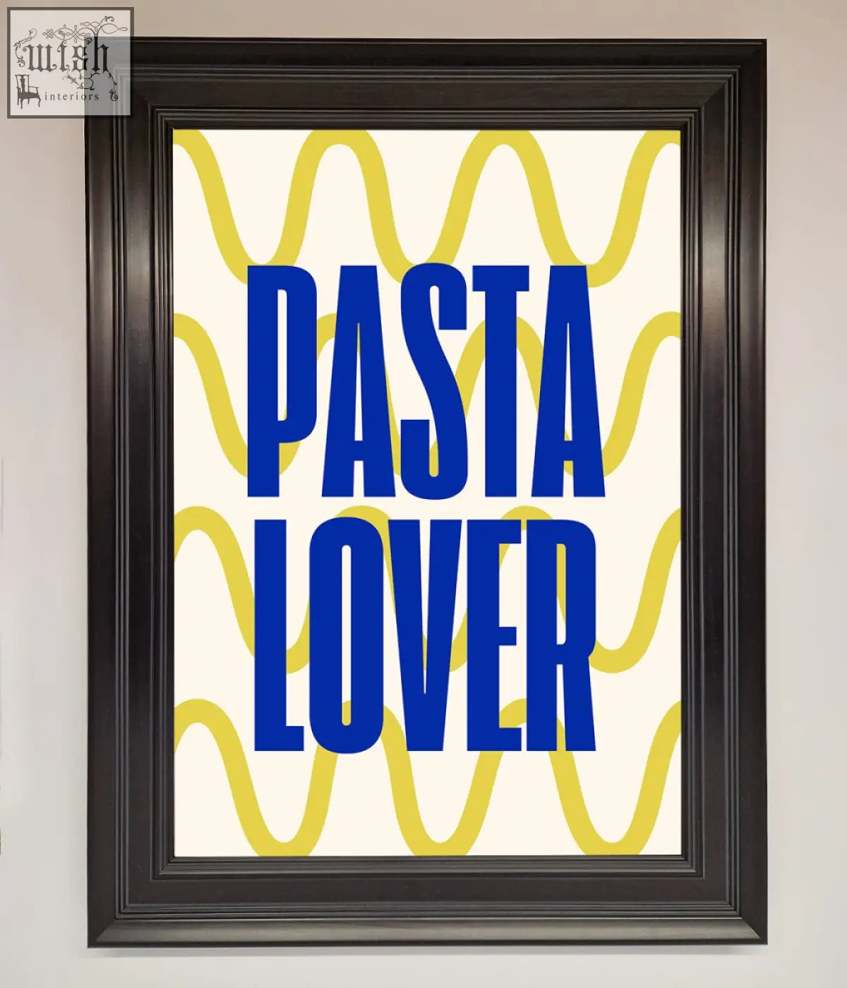A pasta lover framed wall art print with bold blue text and yellow wavy lines in a sleek black frame against cream background