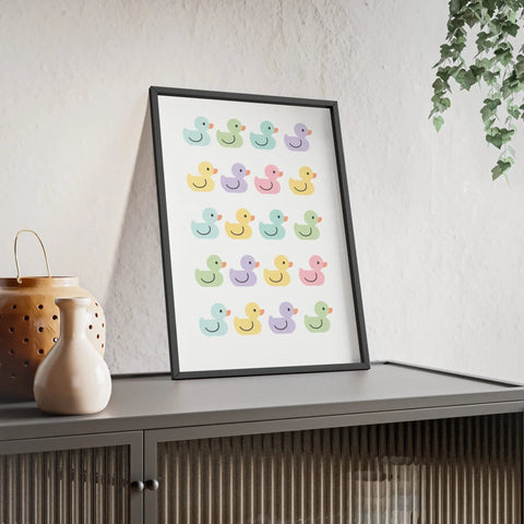 A framed pastel rubber duck poster featuring a colorful grid of cute smiling rubber duck illustrations perfect for bathrooms