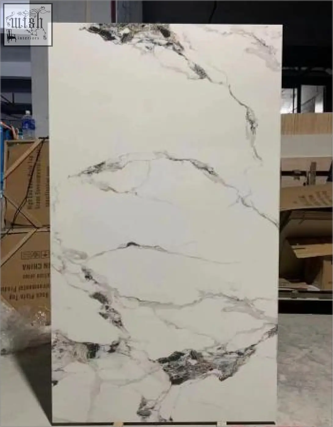 White marble slab with elegant gray veining featuring patek philippe gloss finish on sintered stone surface