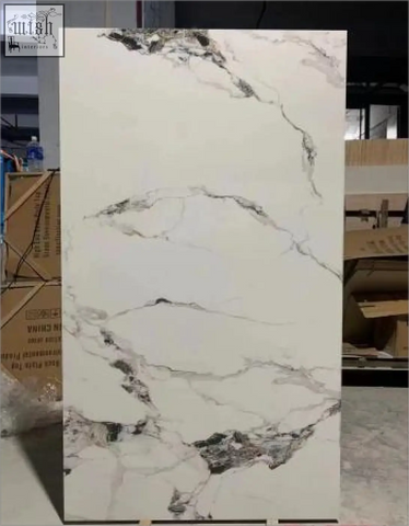 White marble slab with elegant gray veining featuring patek philippe gloss finish on sintered stone surface