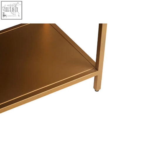 Gold-finished metal shelf with sleek rounded edges on a patna grey mango wood console table with grey mango wood design