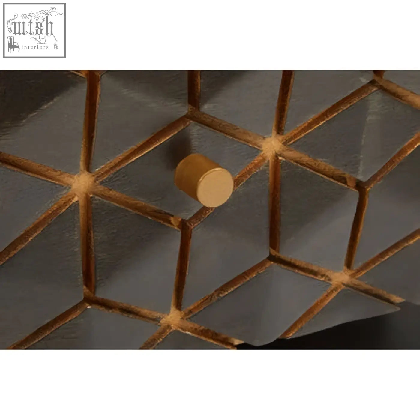 A sleek gold tone hook with matte finish on a dark grey lattice background complements the patna grey mango wood console table