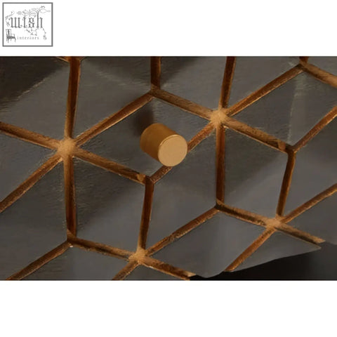 A sleek gold tone hook with matte finish on a dark grey lattice background complements the patna grey mango wood console table
