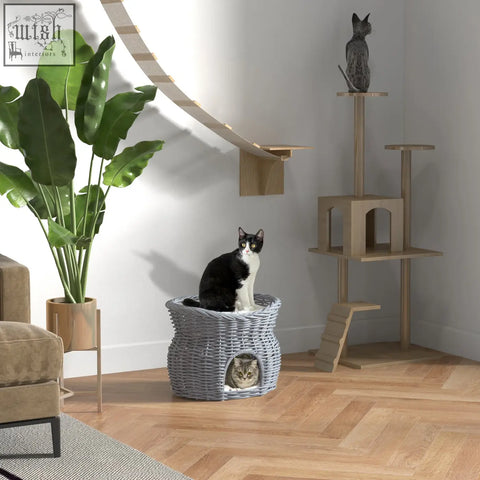 Gray woven wicker 2-tier cat house with two cats inside featuring washable cushions and elevated pet bed design