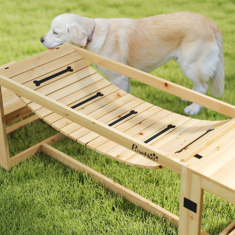 Light-colored wooden dog ramp with black bone cutouts and pawhut logo for dog agility training and soft bridge use