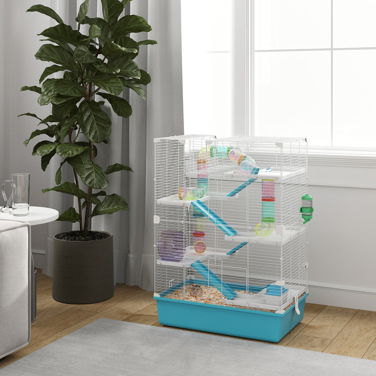 Multi-level white wire hamster cage with turquoise base 58l x 36w includes water bottle and colorful accessories