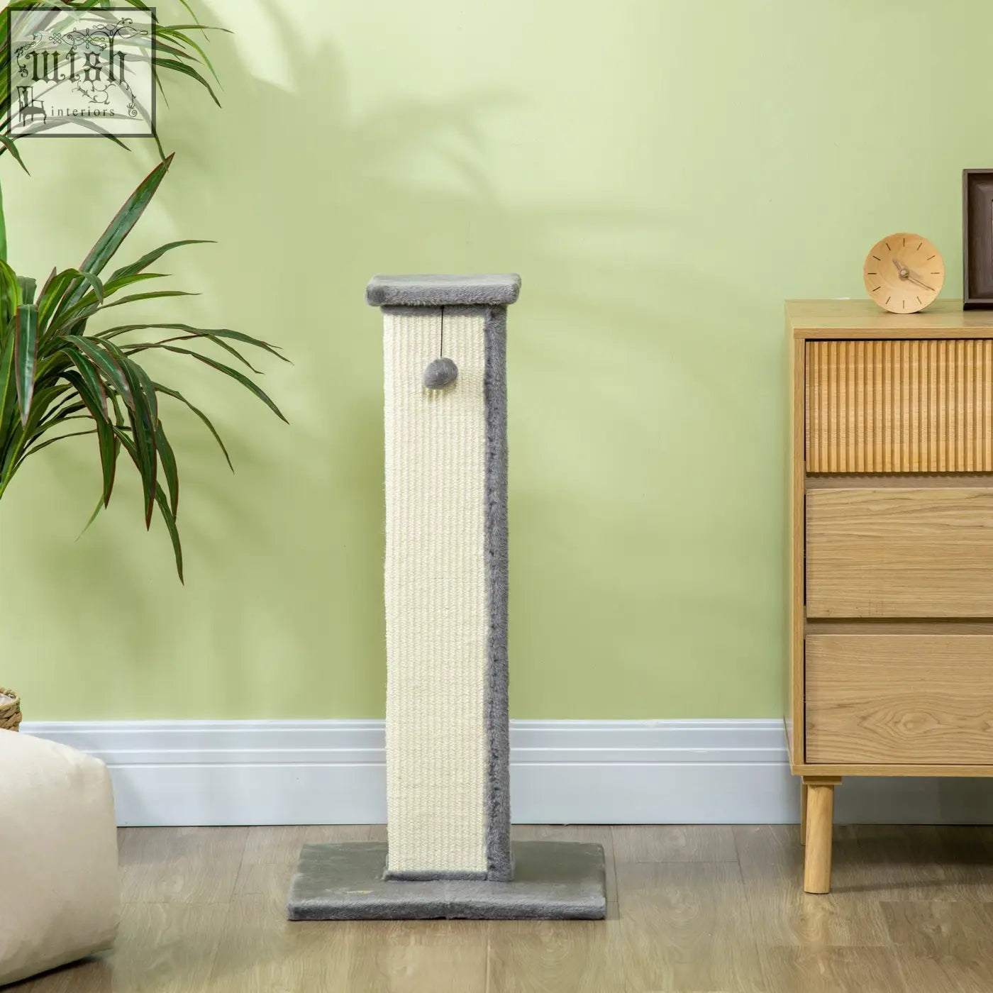 Gray and cream scratching post with soft plush top, natural sisal rope, and hanging ball on particle board base