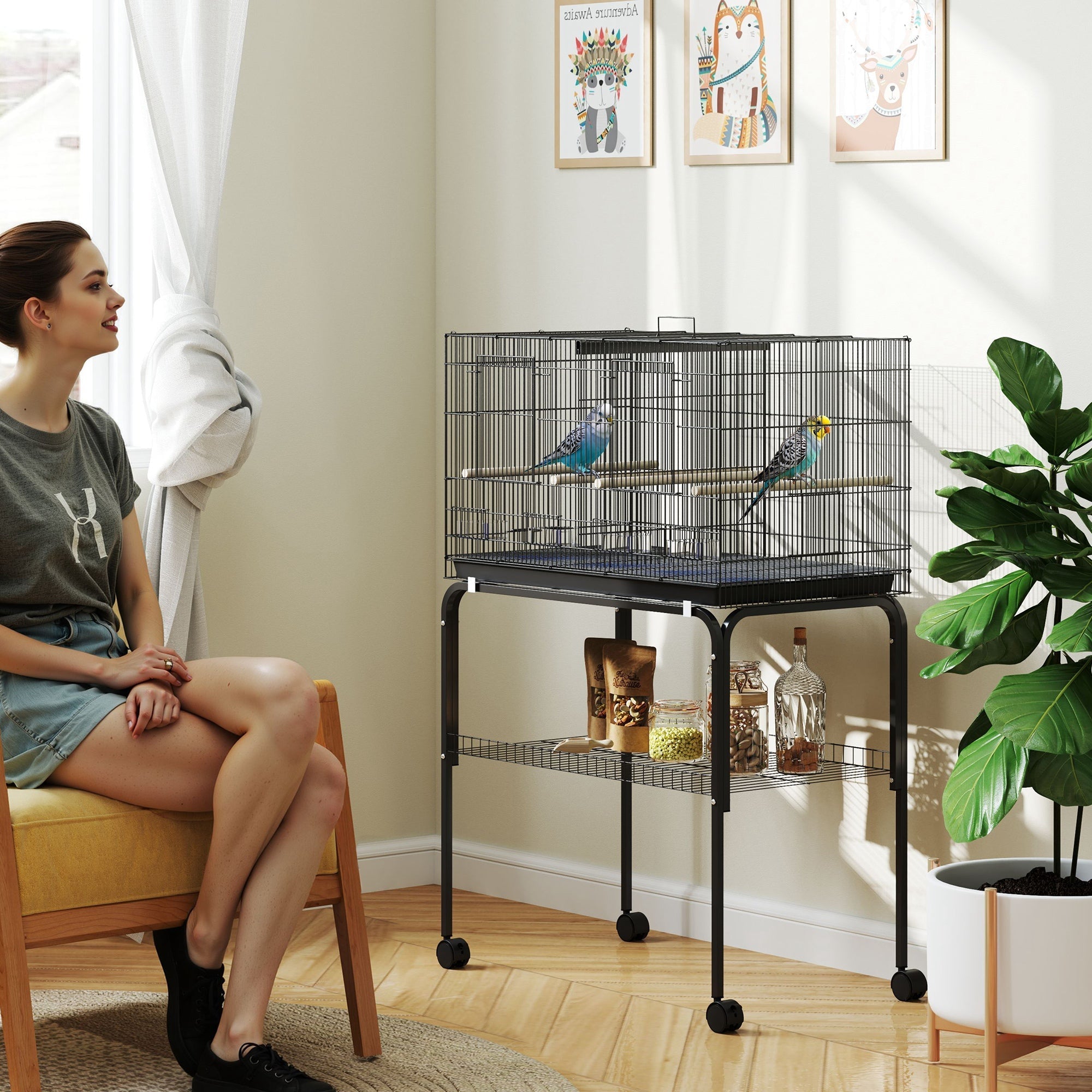 Black metal pawhut bird cage 76l x 46w with wheels lower shelf bar spacing food dishes and two colorful parakeets inside
