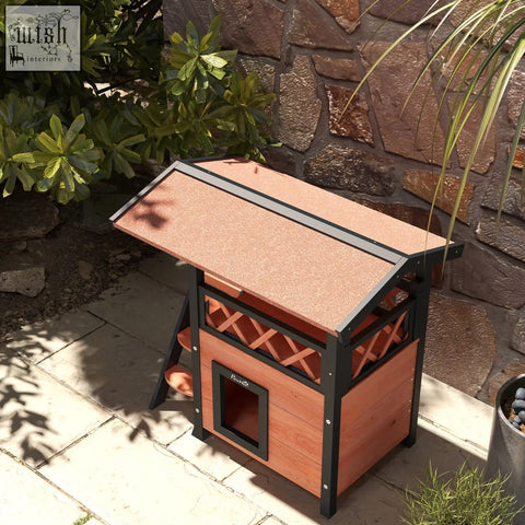 A charming reddish-brown pawhut cat house outdoor with balcony stairs roof made of fir wood and asphalt roof for a dry area