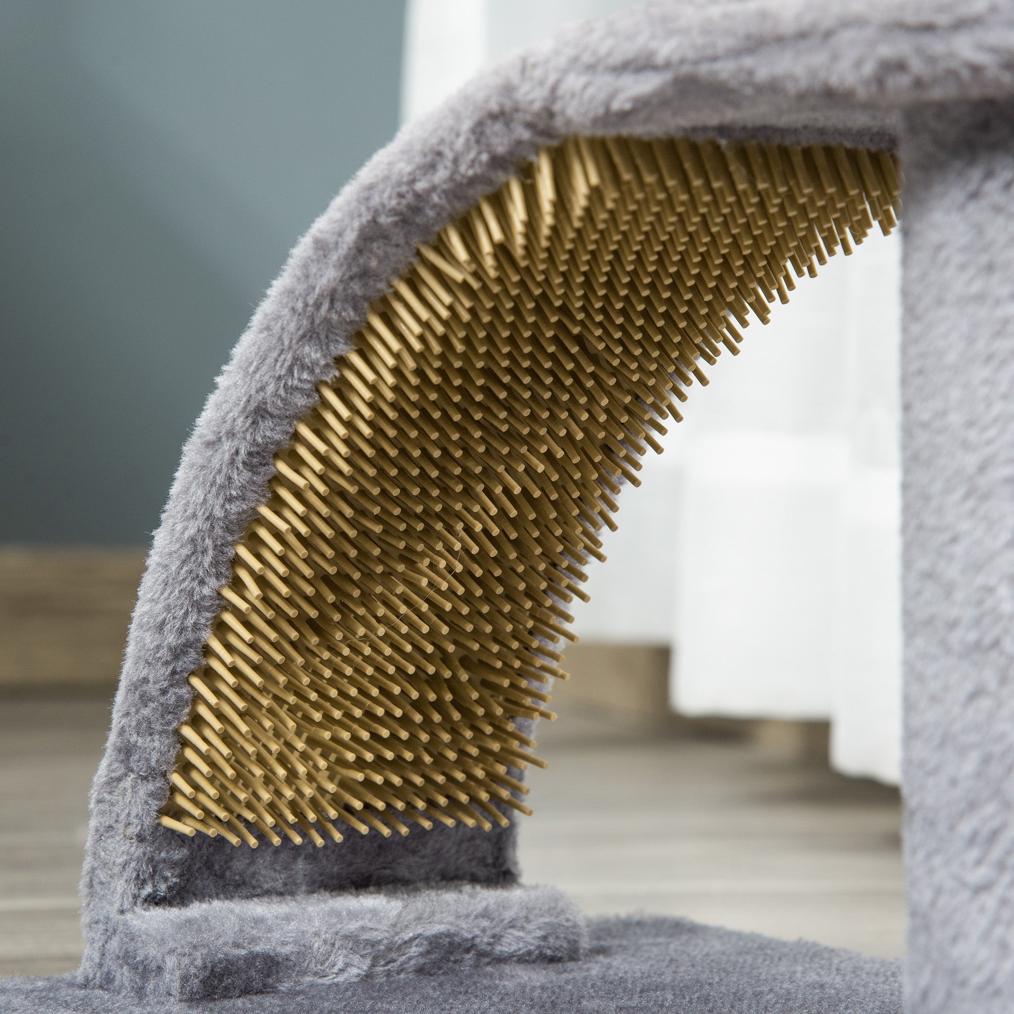 Gray pawhut cat tree with hanging ball and jute scratching massage board featuring curved golden bristle surface